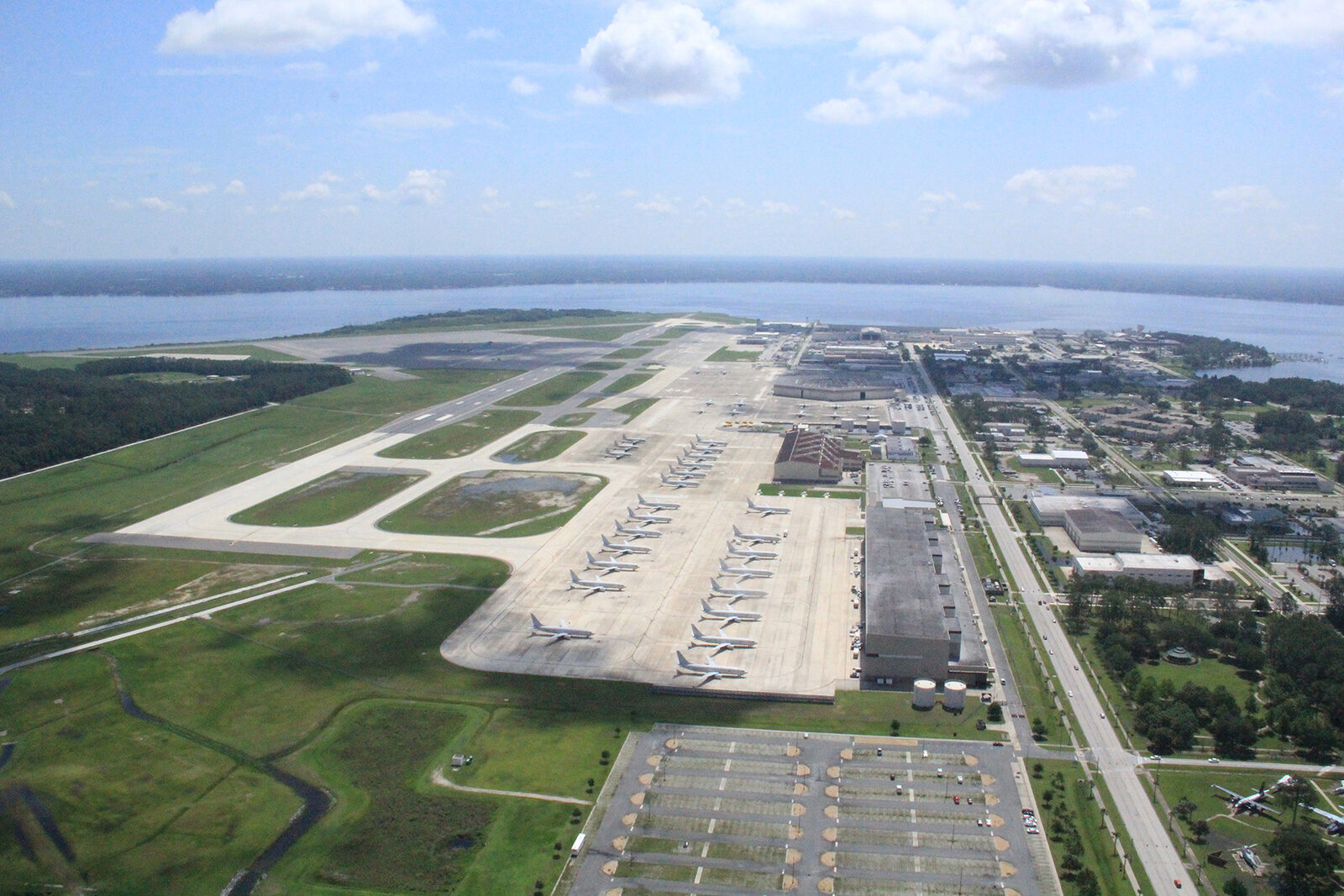 Aerial photograph of Naval Air Station Jacksonville, showing runways, hangars and the St. Johns River