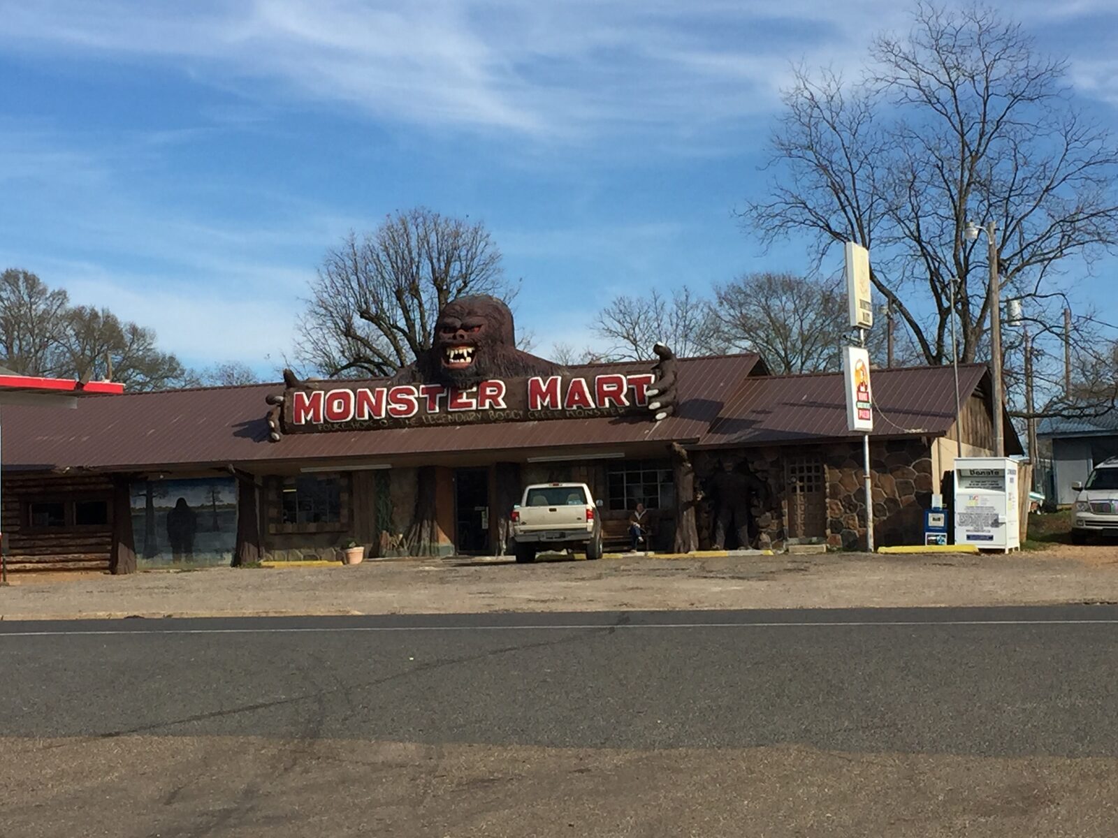The Monster Mart, a single-storey shop in Fouke, Arkansas, with a painted image of a large hairy bipedal creature on its exterior wall.