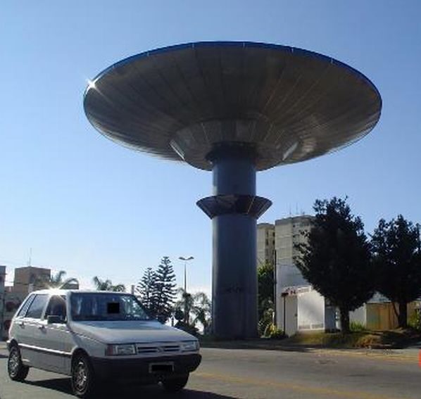 Flying-saucer-shaped water tower on a pole at the central park of Varginha, Brazil
